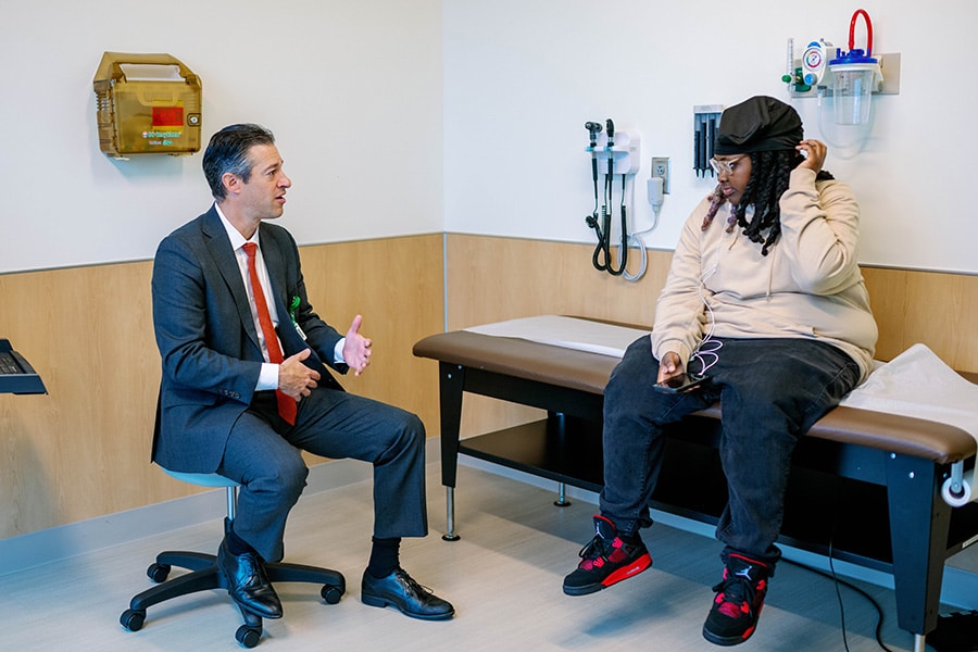 Bariatric surgeon Jonathan Meisel, MD, consulting with bariatric patient at Clinic