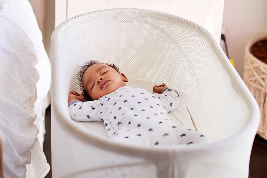 baby bed next to parents